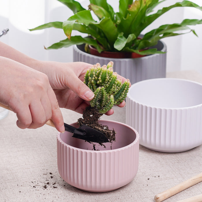 https://jofamy.com/cdn/shop/products/jofamy-modern-neutral-rippled-plastic-planter-pots-3-colors-for-succulents-flower-pots-with-drainage-holes-3_700x700.jpg?v=1658487727